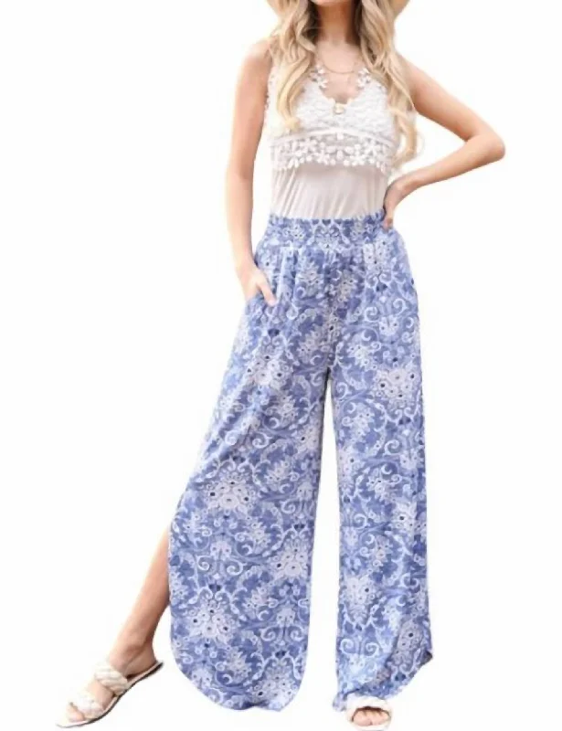 Cutting Edge Fashion Smocked Floral Side Slit Pants In Blue