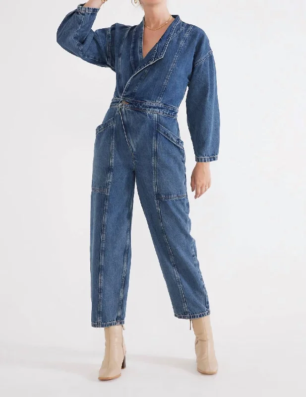 Disco - Inspired Retro Dance Look Liv Asymmetric Denim Jumpsuit In Arctic Storm